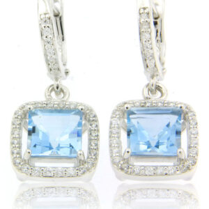 A beautiful pair of Blue Topaz 8mm earrings with CZ accents made in sterling 925 silver.